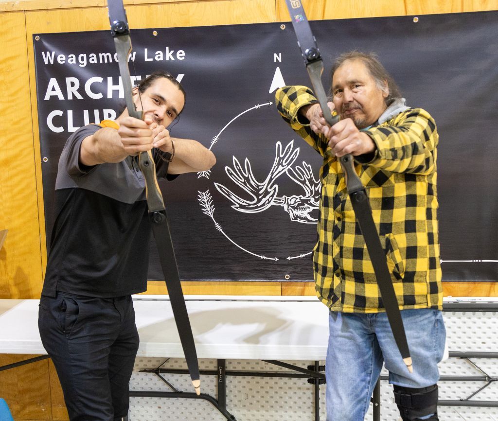 Harold Angeconeb with community elder — Burning Arrow archery program